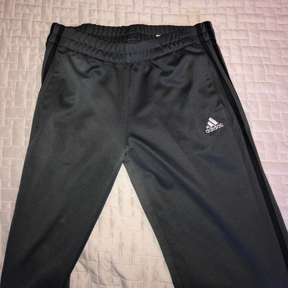 Dark gray adidas pants.